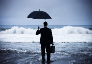 Businessman facing storm.