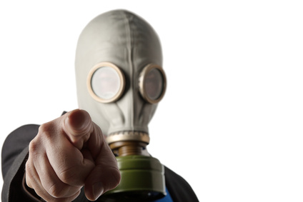 business man wearing a old gas mask