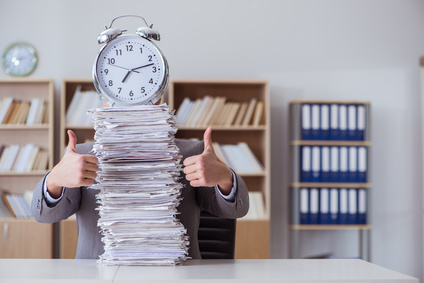 Businessman busy with paperwork in office