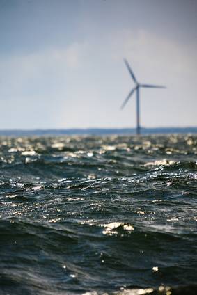 Vertical axis wind turbines generator farm for renewable sustainable and alternative energy production along coast baltic sea near Denmark. Eco power, ecology.