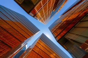 Golden building with blue sky. Windows glass of modern office skyscrapers. facade design. Architecture exterior for cityscape background.