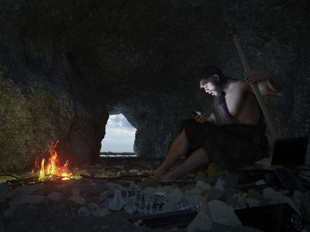 primitive man siting in the cave with smartphone concept illustration